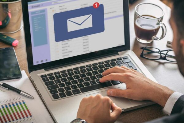 email notification concept, man working on computer
